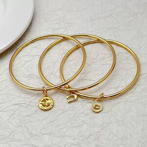 Coach Gold Plated Copper 3-in-1 TripleRing Bracelet Inlaid Letter Carriage Shape